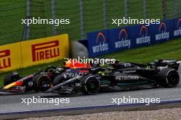 Sergio Perez (MEX) Red Bull Racing RB19 and Lewis Hamilton (GBR) Mercedes AMG F1 W14 battle for position. 02.07.2023. Formula 1 World Championship, Rd 10, Austrian Grand Prix, Spielberg, Austria, Race Day.