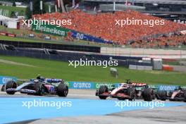 Pierre Gasly (FRA) Alpine F1 Team A523 and Kevin Magnussen (DEN) Haas VF-23. 02.07.2023. Formula 1 World Championship, Rd 10, Austrian Grand Prix, Spielberg, Austria, Race Day.