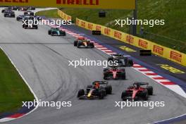 (L to R): Max Verstappen (NLD) Red Bull Racing RB19 and Charles Leclerc (MON) Ferrari SF-23 lead at the start of the race. 02.07.2023. Formula 1 World Championship, Rd 10, Austrian Grand Prix, Spielberg, Austria, Race Day.