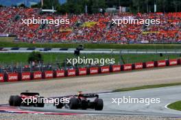 Charles Leclerc (MON) Ferrari SF-23 leads Max Verstappen (NLD) Red Bull Racing RB19. 02.07.2023. Formula 1 World Championship, Rd 10, Austrian Grand Prix, Spielberg, Austria, Race Day.