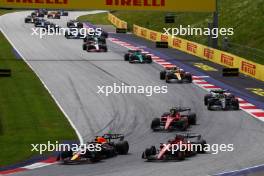 (L to R): Max Verstappen (NLD) Red Bull Racing RB19 and Charles Leclerc (MON) Ferrari SF-23 lead at the start of the race. 02.07.2023. Formula 1 World Championship, Rd 10, Austrian Grand Prix, Spielberg, Austria, Race Day.