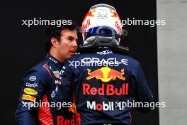 (L to R): Sergio Perez (MEX) Red Bull Racing with team mate Max Verstappen (NLD) Red Bull Racing in parc ferme. 01.07.2023. Formula 1 World Championship, Rd 10, Austrian Grand Prix, Spielberg, Austria, Sprint Day.