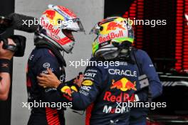 (L to R): Max Verstappen (NLD) Red Bull Racing with team mate Sergio Perez (MEX) Red Bull Racing in parc ferme. 01.07.2023. Formula 1 World Championship, Rd 10, Austrian Grand Prix, Spielberg, Austria, Sprint Day.