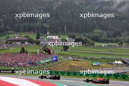 Nico Hulkenberg (GER) Haas VF-23 leads Sergio Perez (MEX) Red Bull Racing RB19. 01.07.2023. Formula 1 World Championship, Rd 10, Austrian Grand Prix, Spielberg, Austria, Sprint Day.