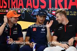 (L to R): Max Verstappen (NLD) Red Bull Racing; Nyck de Vries (NLD) AlphaTauri and Nico Hulkenberg (GER) Haas F1 Team in the FIA Press Conference. 29.06.2023. Formula 1 World Championship, Rd 10, Austrian Grand Prix, Spielberg, Austria, Preparation Day.