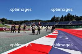 Zhou Guanyu (CHN) Alfa Romeo F1 Team walks the circuit with the team. 29.06.2023. Formula 1 World Championship, Rd 10, Austrian Grand Prix, Spielberg, Austria, Preparation Day.