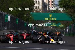 (L to R): Charles Leclerc (MON) Ferrari SF-23 and Max Verstappen (NLD) Red Bull Racing RB19 battle for position. 30.04.2023. Formula 1 World Championship, Rd 4, Azerbaijan Grand Prix, Baku Street Circuit, Azerbaijan, Race Day.