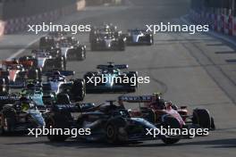 George Russell (GBR) Mercedes AMG F1 W14 and Sergio Perez (MEX) Red Bull Racing RB19 battle for position. 29.04.2023. Formula 1 World Championship, Rd 4, Azerbaijan Grand Prix, Baku Street Circuit, Azerbaijan, Sprint Day.