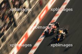 Sergio Perez (MEX) Red Bull Racing RB19 and Charles Leclerc (MON) Ferrari SF-23 battle for the lead of the Sprint race. 29.04.2023. Formula 1 World Championship, Rd 4, Azerbaijan Grand Prix, Baku Street Circuit, Azerbaijan, Sprint Day.