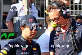 (L to R): Sergio Perez (MEX) Red Bull Racing with Hugh Bird (GBR) Red Bull Racing Engineer on the grid. 29.04.2023. Formula 1 World Championship, Rd 4, Azerbaijan Grand Prix, Baku Street Circuit, Azerbaijan, Sprint Day.
