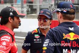 (L to R): Carlos Sainz Jr (ESP) Ferrari with Sergio Perez (MEX) Red Bull Racing and Max Verstappen (NLD) Red Bull Racing on the drivers' parade. 30.04.2023. Formula 1 World Championship, Rd 4, Azerbaijan Grand Prix, Baku Street Circuit, Azerbaijan, Race Day.