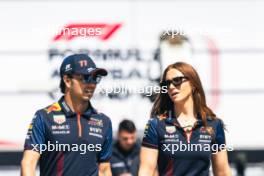 (L to R): Sergio Perez (MEX) Red Bull Racing with Alice Hedworth (GBR) Red Bull Racing Communications Manager. 27.04.2023. Formula 1 World Championship, Rd 4, Azerbaijan Grand Prix, Baku Street Circuit, Azerbaijan, Preparation Day.