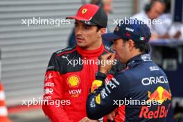 (L to R): Charles Leclerc (MON) Ferrari with Sergio Perez (MEX) Red Bull Racing in qualifying parc ferme. 28.07.2023. Formula 1 World Championship, Rd 13, Belgian Grand Prix, Spa Francorchamps, Belgium, Qualifying Day.