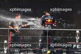 Race winner Max Verstappen (NLD) Red Bull Racing celebrates with Greg Reeson (GBR) Red Bull Racing Tyre Technician on the podium. 30.07.2023. Formula 1 World Championship, Rd 13, Belgian Grand Prix, Spa Francorchamps, Belgium, Race Day.