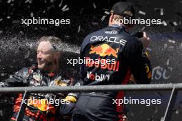 Race winner Max Verstappen (NLD) Red Bull Racing celebrates on the podium with Greg Reeson (GBR) Red Bull Racing Tyre Technician. 30.07.2023. Formula 1 World Championship, Rd 13, Belgian Grand Prix, Spa Francorchamps, Belgium, Race Day.