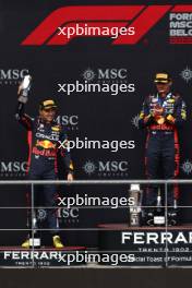 (L to R): Sergio Perez (MEX) Red Bull Racing celebrates his second position on the podium with Max Verstappen (NLD) Red Bull Racing. 30.07.2023. Formula 1 World Championship, Rd 13, Belgian Grand Prix, Spa Francorchamps, Belgium, Race Day.