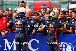 (L to R): Race winner Max Verstappen (NLD) Red Bull Racing celebrates with the team with second placed team mate Sergio Perez (MEX) Red Bull Racing in parc ferme. 30.07.2023. Formula 1 World Championship, Rd 13, Belgian Grand Prix, Spa Francorchamps, Belgium, Race Day.