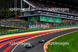 Nico Hulkenberg (GER) Haas VF-23 leads Daniel Ricciardo (AUS) AlphaTauri AT04. 30.07.2023. Formula 1 World Championship, Rd 13, Belgian Grand Prix, Spa Francorchamps, Belgium, Race Day.