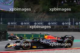 Sergio Perez (MEX) Red Bull Racing RB19 as team mate Max Verstappen (NLD) Red Bull Racing RB19 leaves the pits. 30.07.2023. Formula 1 World Championship, Rd 13, Belgian Grand Prix, Spa Francorchamps, Belgium, Race Day.