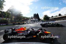 Sergio Perez (MEX) Red Bull Racing RB19 and Lewis Hamilton (GBR) Mercedes AMG F1 W14 battle for position. 29.07.2023. Formula 1 World Championship, Rd 13, Belgian Grand Prix, Spa Francorchamps, Belgium, Sprint Day.