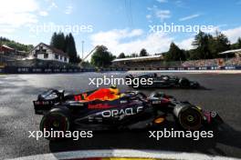 Sergio Perez (MEX) Red Bull Racing RB19 and Lewis Hamilton (GBR) Mercedes AMG F1 W14 battle for position. 29.07.2023. Formula 1 World Championship, Rd 13, Belgian Grand Prix, Spa Francorchamps, Belgium, Sprint Day.