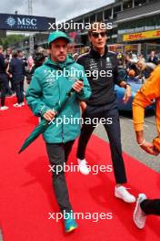 (L to R): Fernando Alonso (ESP) Aston Martin F1 Team and George Russell (GBR) Mercedes AMG F1 on the drivers' parade. 30.07.2023. Formula 1 World Championship, Rd 13, Belgian Grand Prix, Spa Francorchamps, Belgium, Race Day.