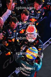 Race winner Max Verstappen (NLD) Red Bull Racing celebrates with third placed Fernando Alonso (ESP) Aston Martin F1 Team in parc ferme. 05.03.2023. Formula 1 World Championship, Rd 1, Bahrain Grand Prix, Sakhir, Bahrain, Race Day.