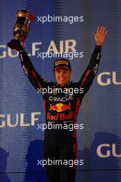 Sergio Perez (MEX) Red Bull Racing celebrates his second position on the podium. 05.03.2023. Formula 1 World Championship, Rd 1, Bahrain Grand Prix, Sakhir, Bahrain, Race Day.