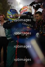 (L to R): Fernando Alonso (ESP) Aston Martin F1 Team celebrates his third position in parc ferme with race winner Max Verstappen (NLD) Red Bull Racing. 05.03.2023. Formula 1 World Championship, Rd 1, Bahrain Grand Prix, Sakhir, Bahrain, Race Day.