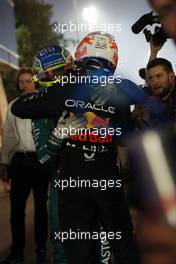 (L to R): Fernando Alonso (ESP) Aston Martin F1 Team celebrates his third position in parc ferme with race winner Max Verstappen (NLD) Red Bull Racing. 05.03.2023. Formula 1 World Championship, Rd 1, Bahrain Grand Prix, Sakhir, Bahrain, Race Day.
