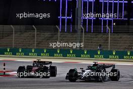 Valtteri Bottas (FIN) Alfa Romeo F1 Team C43 and George Russell (GBR) Mercedes AMG F1 W14 battle for position. 05.03.2023. Formula 1 World Championship, Rd 1, Bahrain Grand Prix, Sakhir, Bahrain, Race Day.