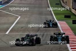 George Russell (GBR) Mercedes AMG F1 W14 and Fernando Alonso (ESP) Aston Martin F1 Team AMR23 battle for position. 05.03.2023. Formula 1 World Championship, Rd 1, Bahrain Grand Prix, Sakhir, Bahrain, Race Day.