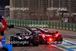 Nico Hulkenberg (GER) Haas VF-23 and Nyck de Vries (NLD) AlphaTauri AT04 leave the pits. 05.03.2023. Formula 1 World Championship, Rd 1, Bahrain Grand Prix, Sakhir, Bahrain, Race Day.