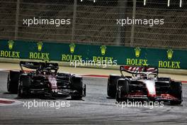 Zhou Guanyu (CHN) Alfa Romeo F1 Team C43 and Nico Hulkenberg (GER) Haas VF-23 battle for position. 05.03.2023. Formula 1 World Championship, Rd 1, Bahrain Grand Prix, Sakhir, Bahrain, Race Day.