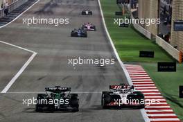 George Russell (GBR) Mercedes AMG F1 W14 and Kevin Magnussen (DEN) Haas VF-23 battle for position. 05.03.2023. Formula 1 World Championship, Rd 1, Bahrain Grand Prix, Sakhir, Bahrain, Race Day.