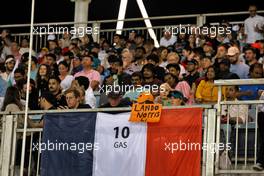 Circuit atmosphere - fans in the grandstand, a flag for Pierre Gasly (FRA) Alpine F1 Team and support for Lando Norris (GBR) McLaren. 04.03.2023. Formula 1 World Championship, Rd 1, Bahrain Grand Prix, Sakhir, Bahrain, Qualifying Day.