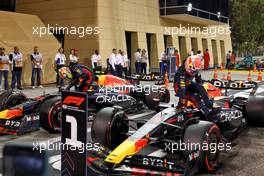 Pole sitter Max Verstappen (NLD) Red Bull Racing RB19 and team mate Sergio Perez (MEX) Red Bull Racing RB19 in qualifying parc ferme. 04.03.2023. Formula 1 World Championship, Rd 1, Bahrain Grand Prix, Sakhir, Bahrain, Qualifying Day.