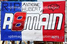 Circuit atmosphere - a fans' french flag with references to Anthoine Hubert, Jules Bianchi, and Romain Grosjean. 04.03.2023. Formula 1 World Championship, Rd 1, Bahrain Grand Prix, Sakhir, Bahrain, Qualifying Day.