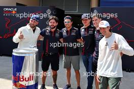 Sergio Perez (MEX) Red Bull Racing and Max Verstappen (NLD) Red Bull Racing with guests of the team. 04.03.2023. Formula 1 World Championship, Rd 1, Bahrain Grand Prix, Sakhir, Bahrain, Qualifying Day.