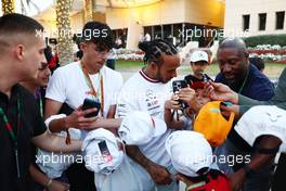 Lewis Hamilton (GBR) Mercedes AMG F1 with fans. 04.03.2023. Formula 1 World Championship, Rd 1, Bahrain Grand Prix, Sakhir, Bahrain, Qualifying Day.