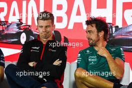 (L to R): Nico Hulkenberg (GER) Haas F1 Team with Fernando Alonso (ESP) Aston Martin F1 Team in the FIA Press Conference. 02.03.2023. Formula 1 World Championship, Rd 1, Bahrain Grand Prix, Sakhir, Bahrain, Preparation Day.