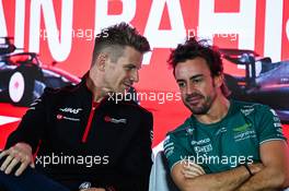 (L to R): Nico Hulkenberg (GER) Haas F1 Team with Fernando Alonso (ESP) Aston Martin F1 Team in the FIA Press Conference. 02.03.2023. Formula 1 World Championship, Rd 1, Bahrain Grand Prix, Sakhir, Bahrain, Preparation Day.