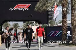 (L to R): Zhou Guanyu (CHN) Alfa Romeo F1 Team with Carlos Sainz Jr (ESP) Ferrari. 02.03.2023. Formula 1 World Championship, Rd 1, Bahrain Grand Prix, Sakhir, Bahrain, Preparation Day.