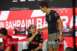 (L to R): Zhou Guanyu (CHN) Alfa Romeo F1 Team and George Russell (GBR) Mercedes AMG F1 in the FIA Press Conference. 02.03.2023. Formula 1 World Championship, Rd 1, Bahrain Grand Prix, Sakhir, Bahrain, Preparation Day.