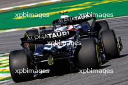 Daniel Ricciardo (AUS) AlphaTauri AT04 follows Yuki Tsunoda (JPN) AlphaTauri AT04. 05.11.2023. Formula 1 World Championship, Rd 21, Brazilian Grand Prix, Sao Paulo, Brazil, Race Day.