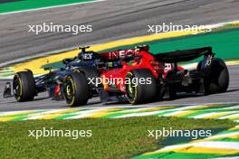 Lewis Hamilton (GBR) Mercedes AMG F1 W14 leads Carlos Sainz Jr (ESP) Ferrari SF-23. 05.11.2023. Formula 1 World Championship, Rd 21, Brazilian Grand Prix, Sao Paulo, Brazil, Race Day.