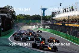 Max Verstappen (NLD) Red Bull Racing RB19 leads at the start of the race as Alexander Albon (THA) Williams Racing FW45 and Kevin Magnussen (DEN) Haas VF-23 crash. 05.11.2023. Formula 1 World Championship, Rd 21, Brazilian Grand Prix, Sao Paulo, Brazil, Race Day.