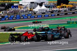 Carlos Sainz Jr (ESP) Ferrari SF-23 and Lance Stroll (CDN) Aston Martin F1 Team AMR23 battle for position. 05.11.2023. Formula 1 World Championship, Rd 21, Brazilian Grand Prix, Sao Paulo, Brazil, Race Day.