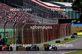 (L to R): Charles Leclerc (MON) Ferrari SF-23 with Lewis Hamilton (GBR) Mercedes AMG F1 W14 and Yuki Tsunoda (JPN) AlphaTauri AT04. 04.11.2023. Formula 1 World Championship, Rd 21, Brazilian Grand Prix, Sao Paulo, Brazil, Sprint Day.