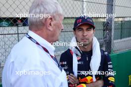 (L to R): Dr Helmut Marko (AUT) Red Bull Motorsport Consultant and Sergio Perez (MEX) Red Bull Racing on the grid. 04.11.2023. Formula 1 World Championship, Rd 21, Brazilian Grand Prix, Sao Paulo, Brazil, Sprint Day.